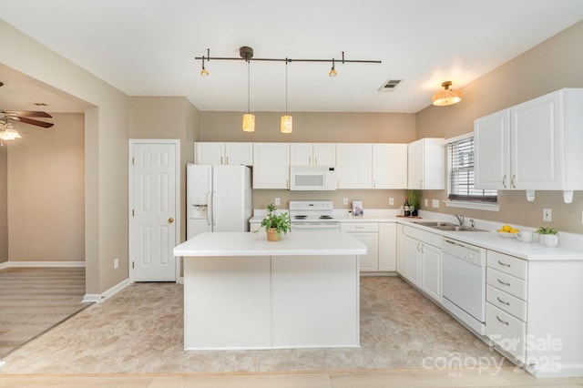 1720 Chamberside Dr, Rock Hill, SC 29730 - kitchen featuring white cabinetry, visible vents, a sink, and white appliances