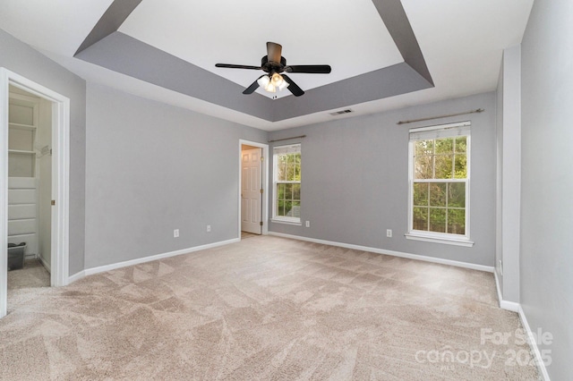 1720 Chamberside Dr, Rock Hill, SC 29730 - unfurnished bedroom featuring carpet floors, a tray ceiling, visible vents, and multiple windows