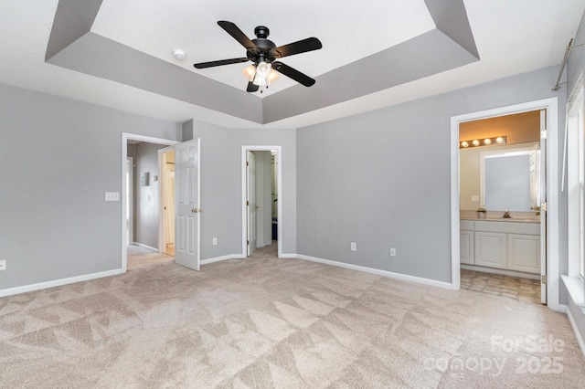 1720 Chamberside Dr, Rock Hill, SC 29730 - unfurnished bedroom with baseboards, a tray ceiling, and light colored carpet