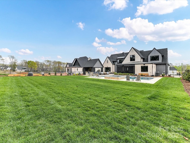 406 Sugar Maple Ln, Weddington, NC 28104 - rear view of house featuring an outdoor pool, a patio area, and board and batten siding