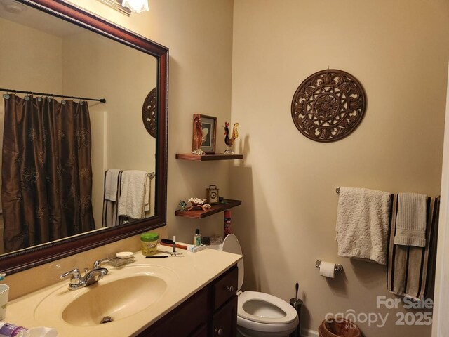 86614 Arrington Rd, Lancaster, SC 29720 - bathroom with toilet, vanity, and a shower with curtain