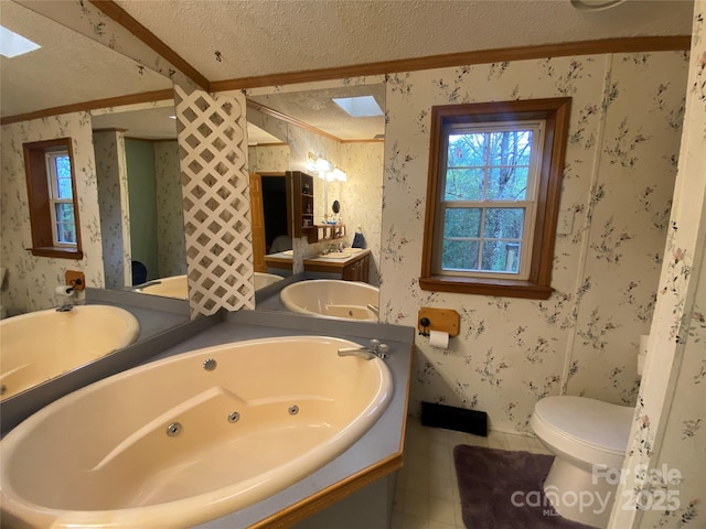 full bath featuring a textured ceiling, wallpapered walls, and a tub with jets