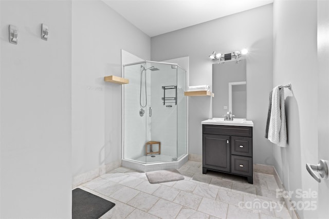 925 Westmere Ave, Charlotte, NC 28208 - bathroom featuring a stall shower, baseboards, and vanity