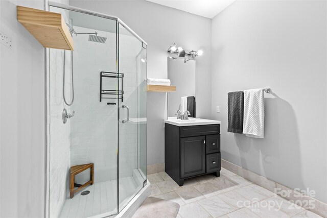925 Westmere Ave, Charlotte, NC 28208 - full bathroom with a shower stall, baseboards, and vanity