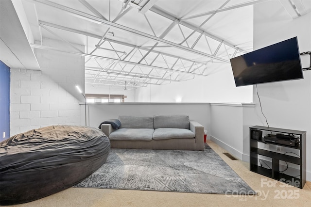 925 Westmere Ave, Charlotte, NC 28208 - living area with baseboards, concrete block wall, and visible vents