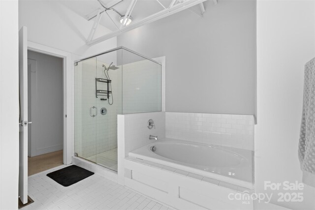 925 Westmere Ave, Charlotte, NC 28208 - bathroom with a stall shower, tile patterned floors, and a bath