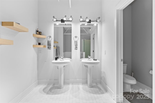 925 Westmere Ave, Charlotte, NC 28208 - full bath featuring baseboards, toilet, and tile patterned flooring