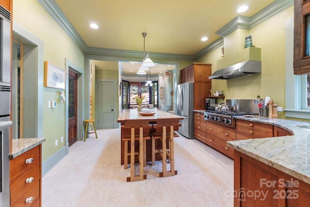 156 Cumberland Ave, Asheville, NC 28801 - kitchen featuring stainless steel appliances, brown cabinets, crown molding, wall chimney range hood, and light stone countertops