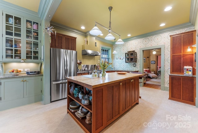 156 Cumberland Ave, Asheville, NC 28801 - kitchen featuring freestanding refrigerator, butcher block countertops, crown molding, ventilation hood, and a kitchen island