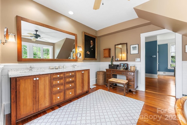 156 Cumberland Ave, Asheville, NC 28801 - bathroom featuring ceiling fan, wainscoting, wood finished floors, and double vanity