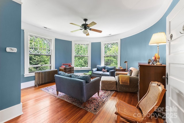 156 Cumberland Ave, Asheville, NC 28801 - living area with radiator heating unit, a ceiling fan, wood-type flooring, and baseboards