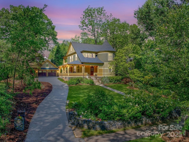 156 Cumberland Ave, Asheville, NC 28801 - victorian house featuring covered porch, an outdoor structure, and a yard