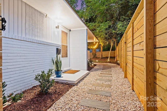 view of property exterior with a fenced backyard