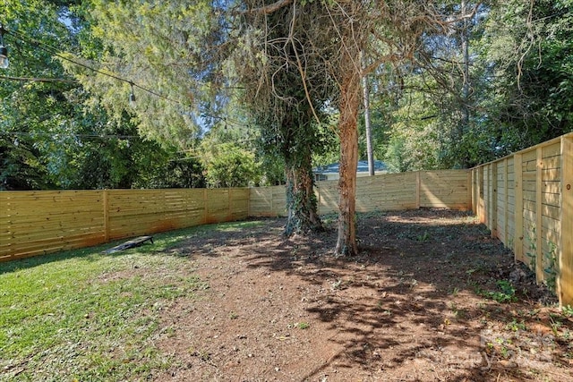 view of yard with a fenced backyard