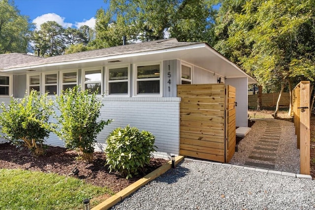 view of outbuilding with fence