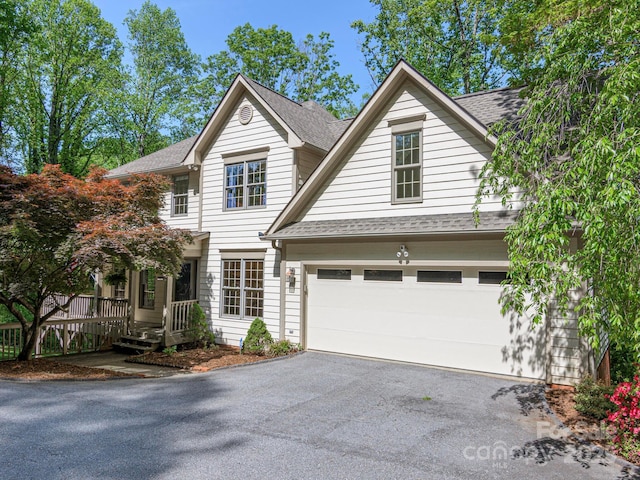102 Galloway Dr, Asheville, NC 28803 - view of front facade featuring a garage, a shingled roof, and aphalt driveway