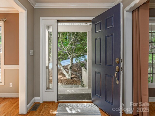 102 Galloway Dr, Asheville, NC 28803 - entryway featuring baseboards, ornamental molding, wood finished floors, and visible vents