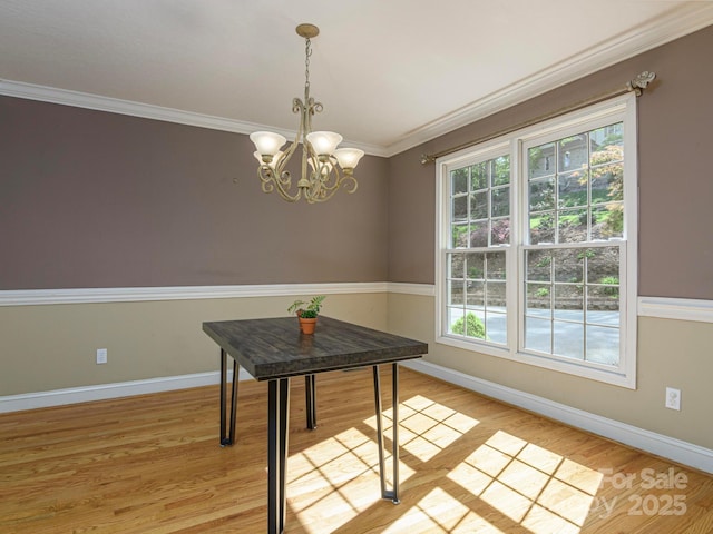 102 Galloway Dr, Asheville, NC 28803 - dining area with crown molding, baseboards, a chandelier, and light wood finished floors