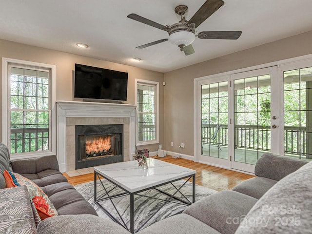 102 Galloway Dr, Asheville, NC 28803 - living area featuring a ceiling fan, wood finished floors, a tile fireplace, baseboards, and recessed lighting