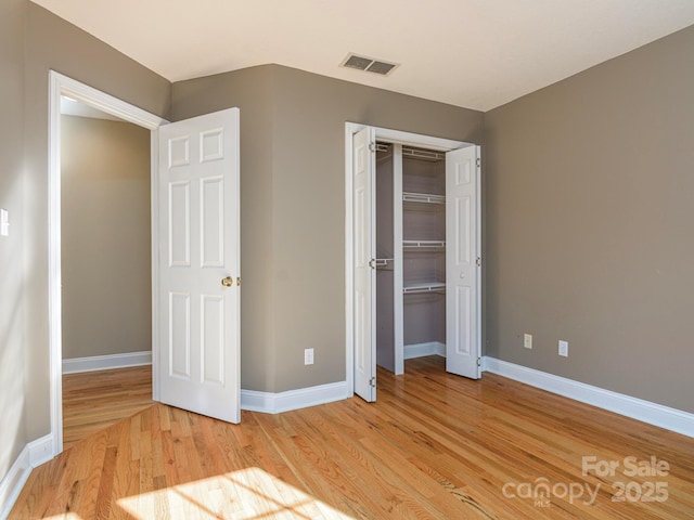 102 Galloway Dr, Asheville, NC 28803 - unfurnished bedroom featuring light wood-style floors, baseboards, a closet, and visible vents