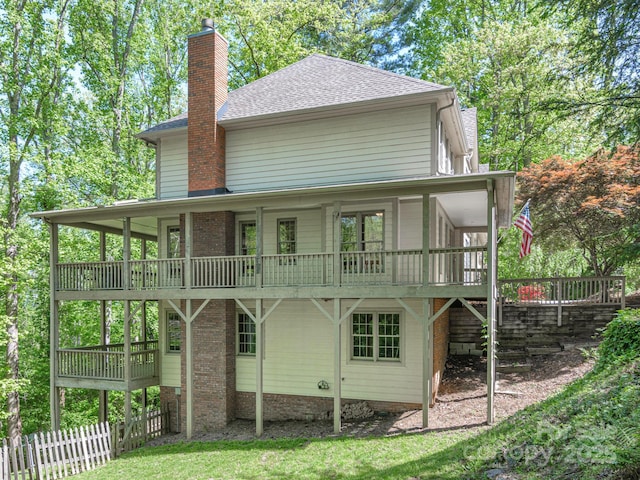 102 Galloway Dr, Asheville, NC 28803 - rear view of house with a deck, fence, a chimney, and roof with shingles