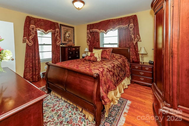 bedroom featuring wood finished floors