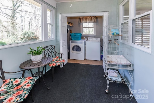 laundry room featuring washer and clothes dryer and laundry area