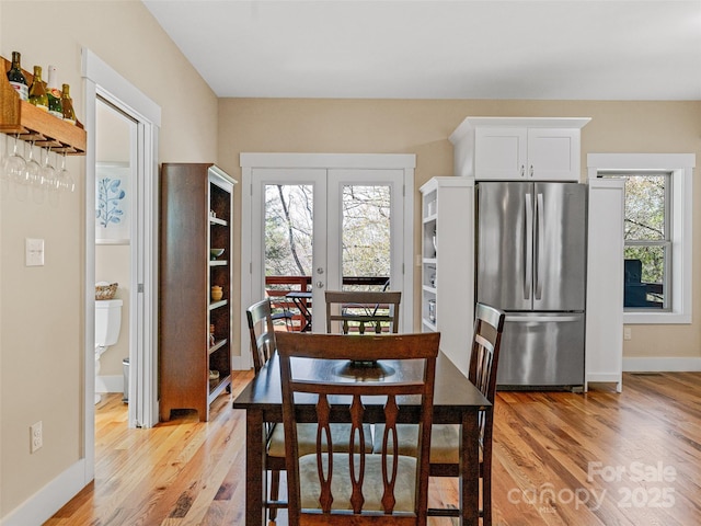 219 Westover Aly, Asheville, NC 28801 - dining space featuring baseboards, light wood finished floors, and a wealth of natural light