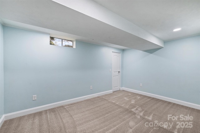 below grade area with baseboards, recessed lighting, and carpet