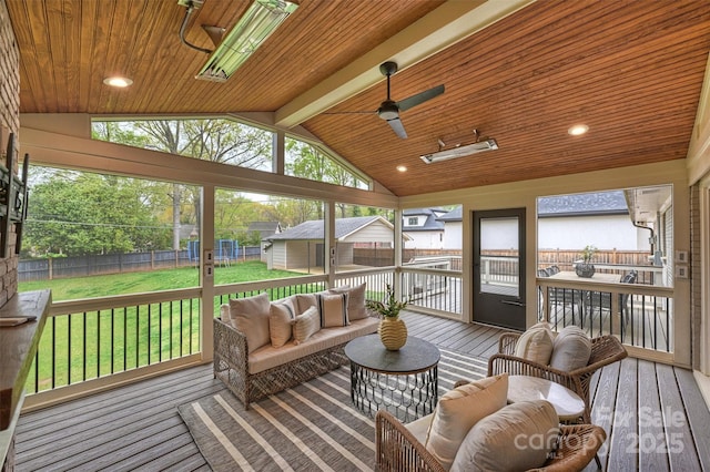 sunroom / solarium featuring an outdoor hangout area, ceiling fan, and beam ceiling