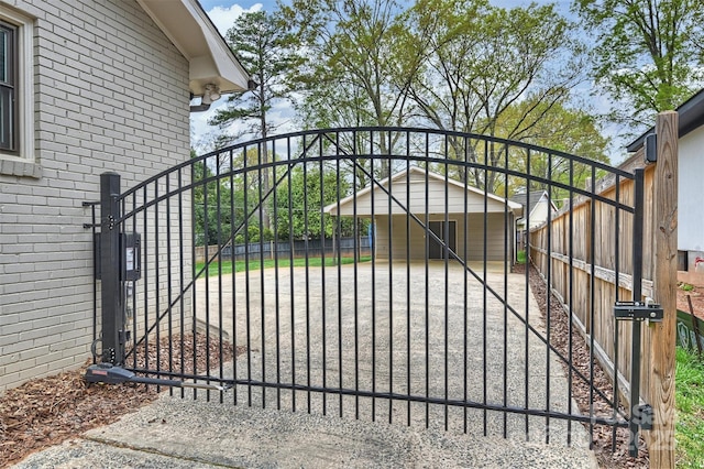 view of gate with fence