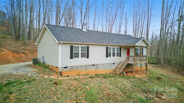 view of front of property with stairway, central air condition unit, crawl space, and roof with shingles