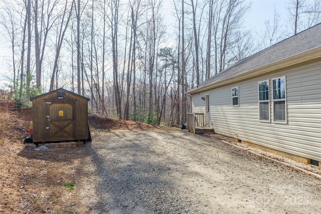view of yard with an outbuilding and a storage unit