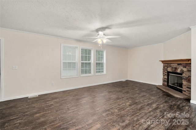 61 Evelyn Acres Dr, Asheville, NC 28806 - unfurnished living room featuring a ceiling fan, ornamental molding, a textured ceiling, dark wood finished floors, and a stone fireplace