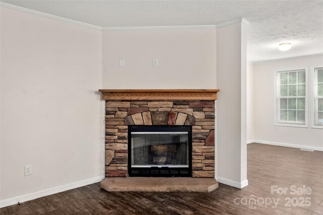 61 Evelyn Acres Dr, Asheville, NC 28806 - detailed view of wood finished floors, crown molding, a stone fireplace, and a textured ceiling
