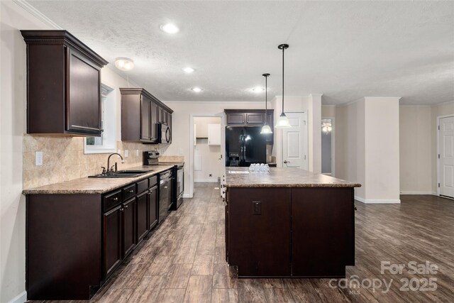 61 Evelyn Acres Dr, Asheville, NC 28806 - kitchen with black appliances, dark brown cabinets, dark wood-style floors, recessed lighting, and crown molding
