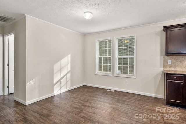 61 Evelyn Acres Dr, Asheville, NC 28806 - unfurnished dining area featuring ornamental molding, dark wood-style floors, and a textured ceiling