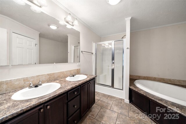 61 Evelyn Acres Dr, Asheville, NC 28806 - full bathroom with a shower stall, a bath, double vanity, and a textured ceiling