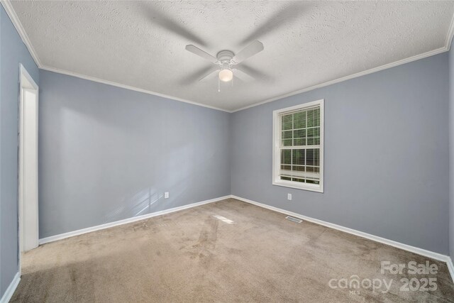 61 Evelyn Acres Dr, Asheville, NC 28806 - carpeted empty room featuring a ceiling fan, ornamental molding, and a textured ceiling