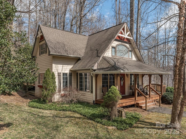 360 Laurel Ridge Rd, Maggie Valley, NC 28751 - view of front of house with a porch, a shingled roof, and a front yard