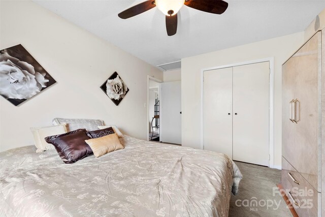 carpeted bedroom featuring a ceiling fan and a closet