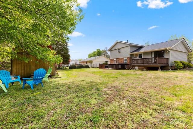 view of yard featuring a wooden deck