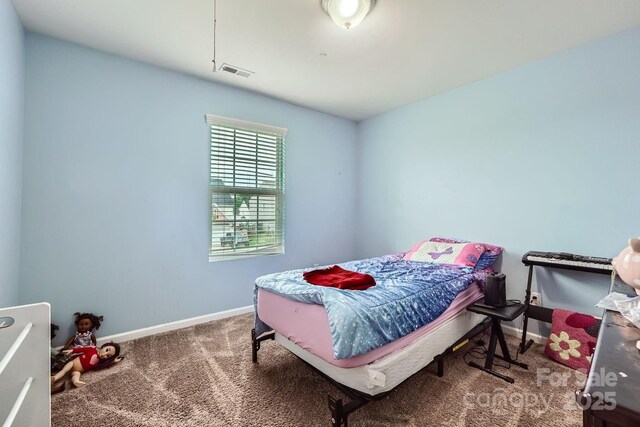bedroom featuring carpet, visible vents, and baseboards