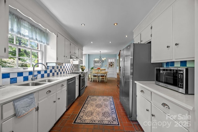 5510 Sardis Rd, Charlotte, NC 28270 - kitchen featuring stainless steel appliances, a sink, white cabinetry, tasteful backsplash, and recessed lighting