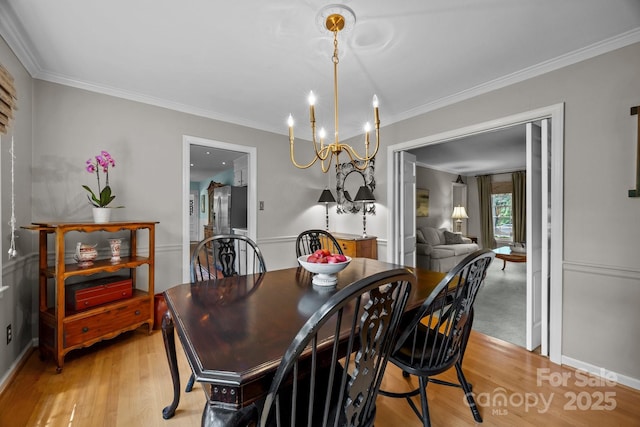 5510 Sardis Rd, Charlotte, NC 28270 - dining space featuring a chandelier, ornamental molding, light wood finished floors, and baseboards
