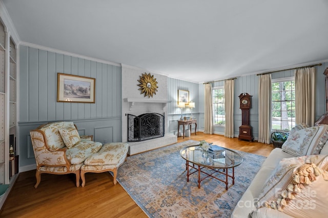 5510 Sardis Rd, Charlotte, NC 28270 - living room featuring crown molding, wood finished floors, a fireplace, and baseboards