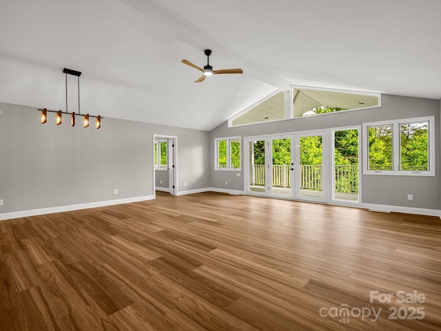 153 Old Lakey Gap Rd, Black Mountain, NC 28711 - unfurnished living room with ceiling fan, baseboards, wood finished floors, and lofted ceiling