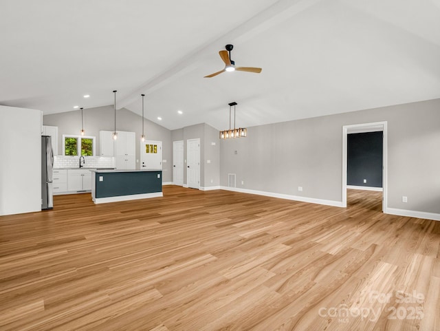 153 Old Lakey Gap Rd, Black Mountain, NC 28711 - unfurnished living room with ceiling fan, light wood-style flooring, baseboards, and a sink