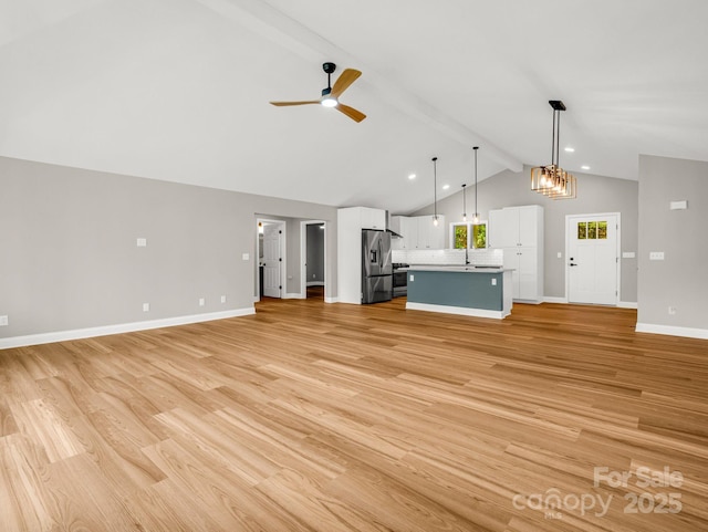153 Old Lakey Gap Rd, Black Mountain, NC 28711 - unfurnished living room with light wood-style floors, ceiling fan, baseboards, recessed lighting, and a chandelier