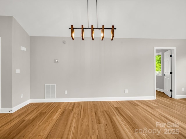 153 Old Lakey Gap Rd, Black Mountain, NC 28711 - unfurnished living room with light wood-style flooring and baseboards